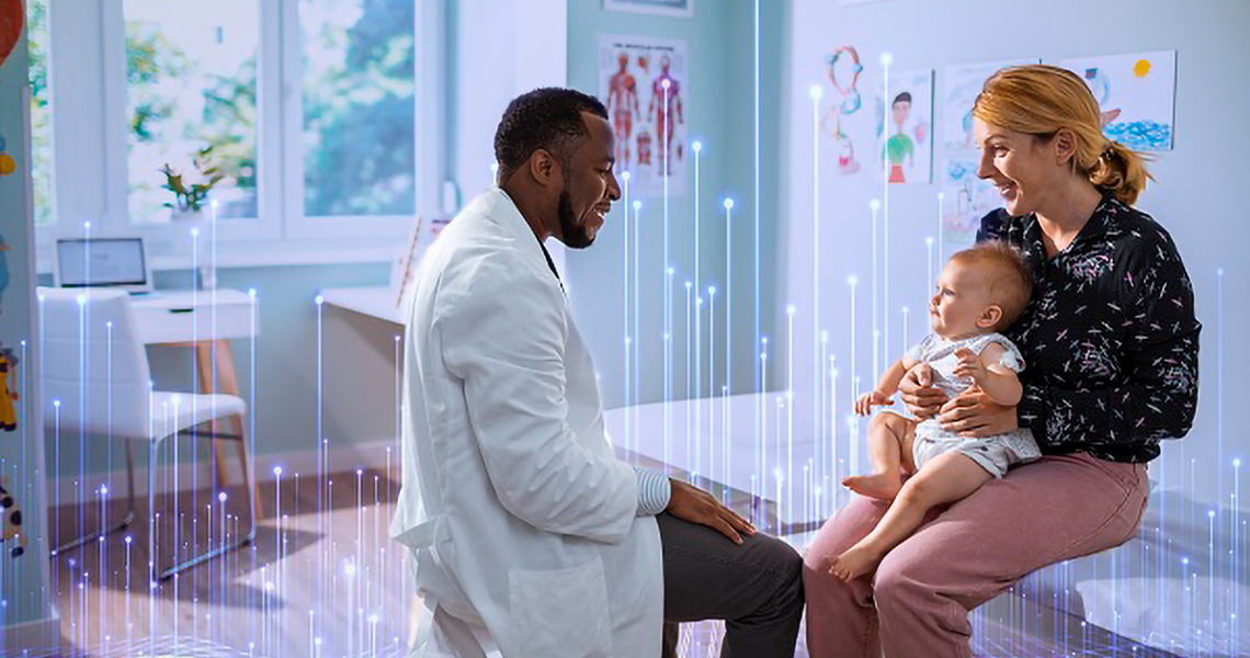 A doctor having the conversation with the mother and the baby in the clinic