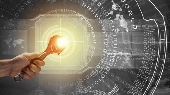 Close up of a hand holding a spanner with bright focus light in background overlaid with graphics of binary numbers