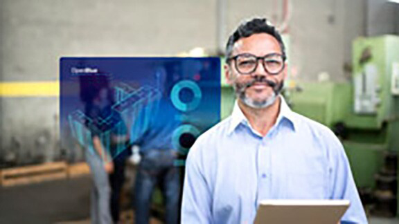 Man using a tablet, overlaid with an infographic of OpenBlue Enterprise Manager